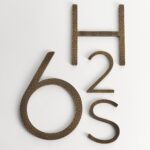 Caratteri EZRA in ottone anticato martellato