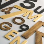 Caratteri METRO in ottone satinato